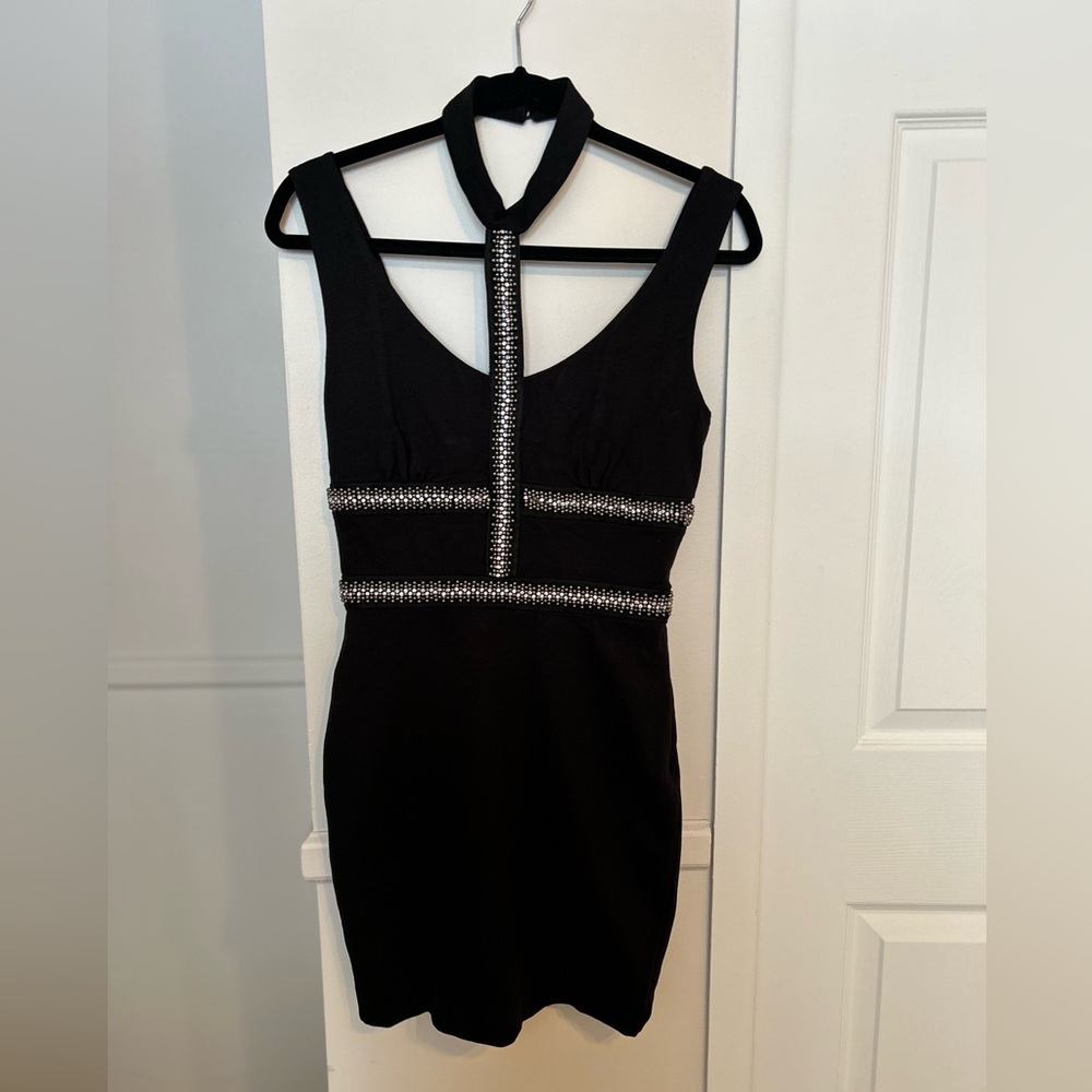Size small Halter Open back dress in black.
Brand New with tag